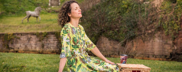 how to picnic perfectly - lady on picnic rug with hamper