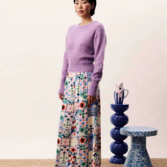 Wide-leg patchwork print trousers with high waist and side-tie fastening in a multicoloured bohemian design.