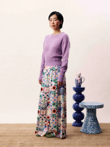 Wide-leg patchwork print trousers with high waist and side-tie fastening in a multicoloured bohemian design.