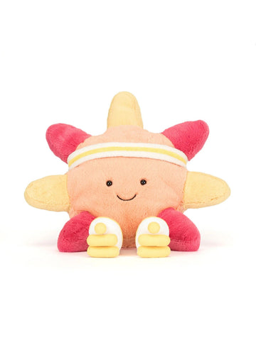 A plush toy shaped like a smiling sun or flower with a peach face, yellow petals, pink petals, and small white shoes, photographed on a clean white background.