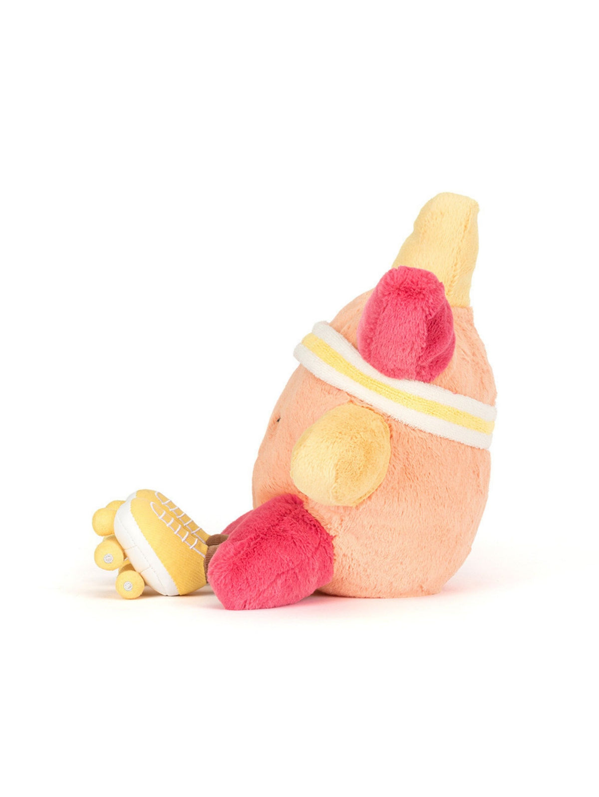 A plush toy shaped like a stylized peach-colored body with bright pink feet and yellow hands, wearing a white and yellow headband, photographed on a clean white background.