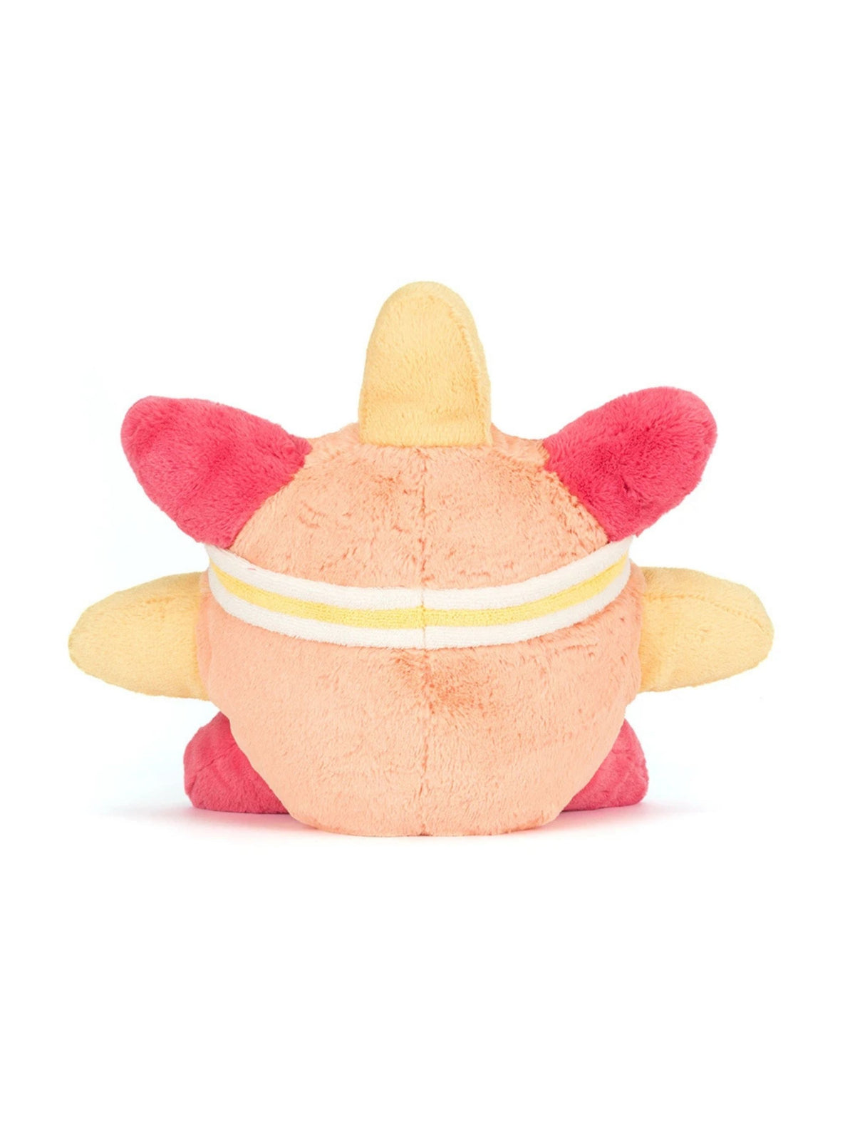A plush toy character shown from the back, featuring a peach-colored body, bright pink ears and feet, and a yellow horn on top, with a white and yellow striped band around its waist, set against a plain white background.