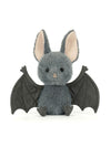 A plush toy bat in medium gray with large black wings, pink inner ears, and small black feet, sitting against a plain white background.