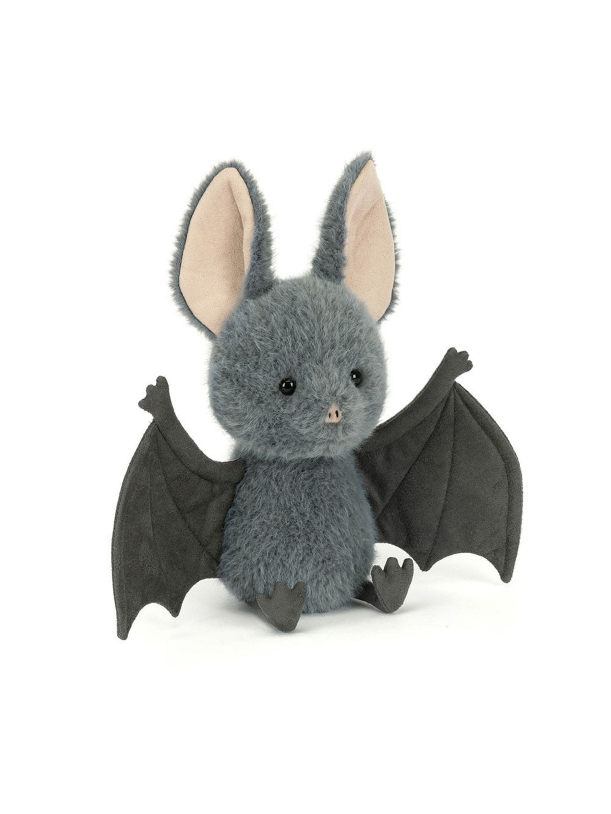 A plush toy bat in dark gray with large black wings, pink inner ears, and small black feet, photographed on a clean white background.