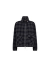 A dark navy and black plaid zip-up jacket with a high stand collar and two front flap pockets, shown on a plain white background.
