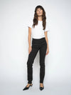 Woman wearing a white t-shirt and black pants on a white background