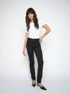 Woman wearing a white t-shirt and black pants on a white background