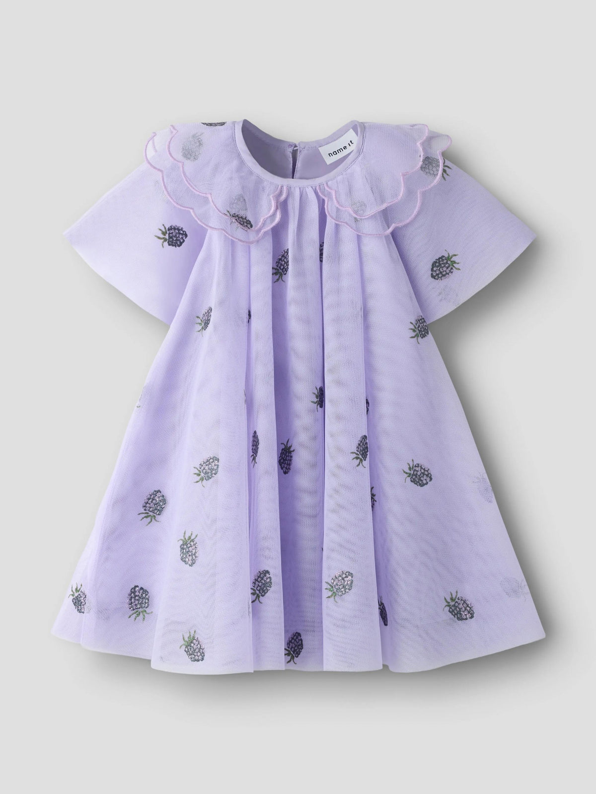 A light purple baby dress with a ruffled Peter Pan collar and scattered embroidered pineapples, shown against a neutral light gray background.