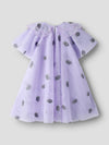Lavender dress with black floral patterns on a light gray background