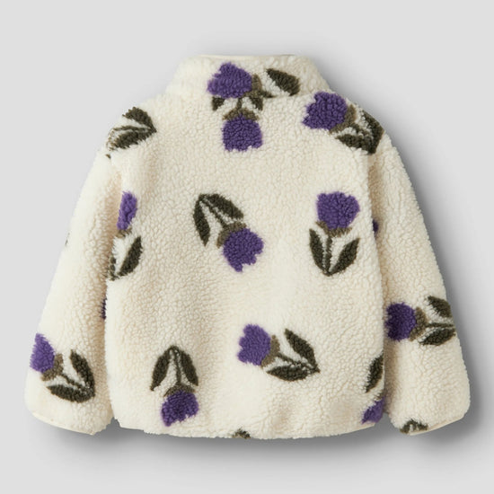 White fleece jacket with purple floral patterns on a light gray background