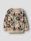 A children's long-sleeve crewneck sweatshirt featuring a colorful cartoon animal comic strip print on a beige background, with solid beige ribbed cuffs and hem, shown against a light gray background.