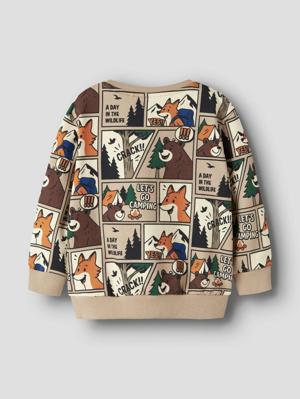 A children's long-sleeve sweatshirt with a beige base and a cartoon comic-panel print featuring foxes, bears, pine trees, and camping text, shown on a light gray background.