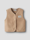beige teddy vest on a grey background