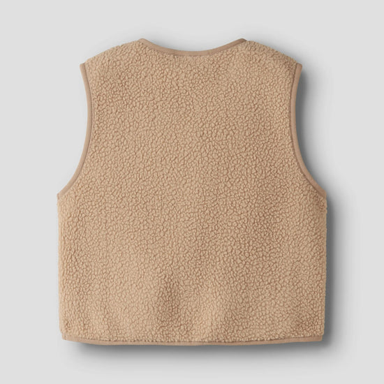 the back of a beige teddy vest on a grey background