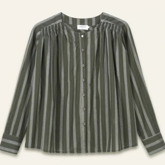 A long-sleeve button-front blouse with vertical stripes in olive green, featuring a pleated yoke at the neckline, shown against a light cream background.