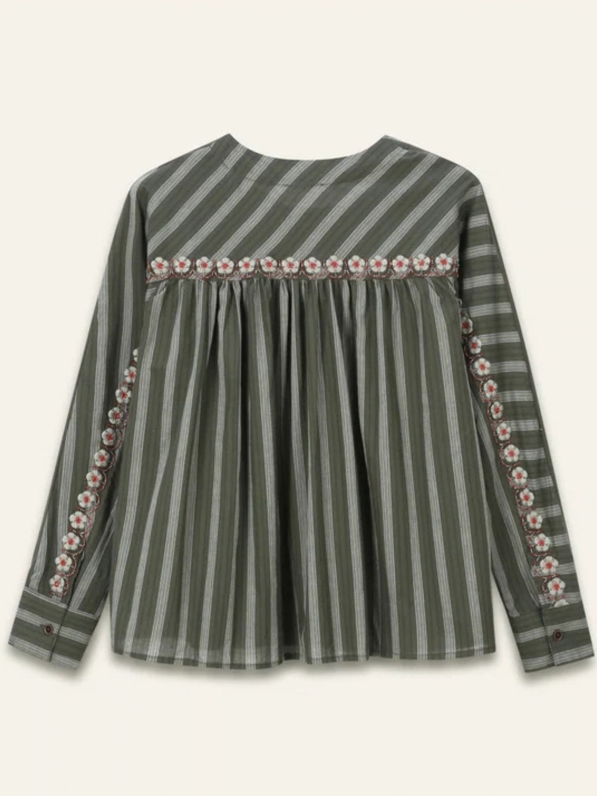 A long-sleeve striped top in olive green with a decorative floral border across the chest and along the sleeve cuffs, shown against a light cream background.