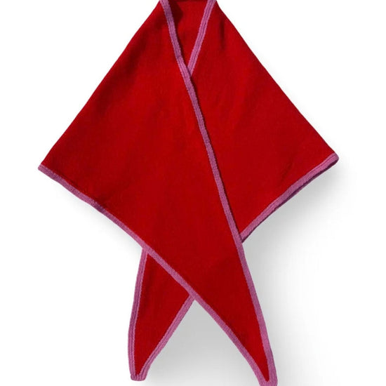 A folded Red Triangular Scarf with Pink trim, arranged in a crossed pattern on a white background.