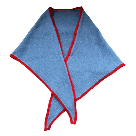 A light blue triangular scarf with red trim, folded and displayed on a solid white background.