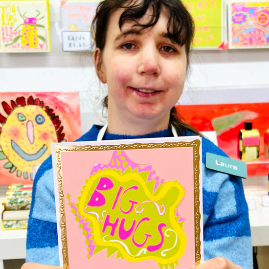 Arthouse Unlimited Big Hugs Greetings Card held by Artist Laura
