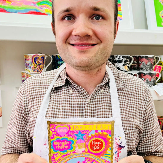 Arthouse Unlimited Take It Easy Greetings Card held by Artist Jack