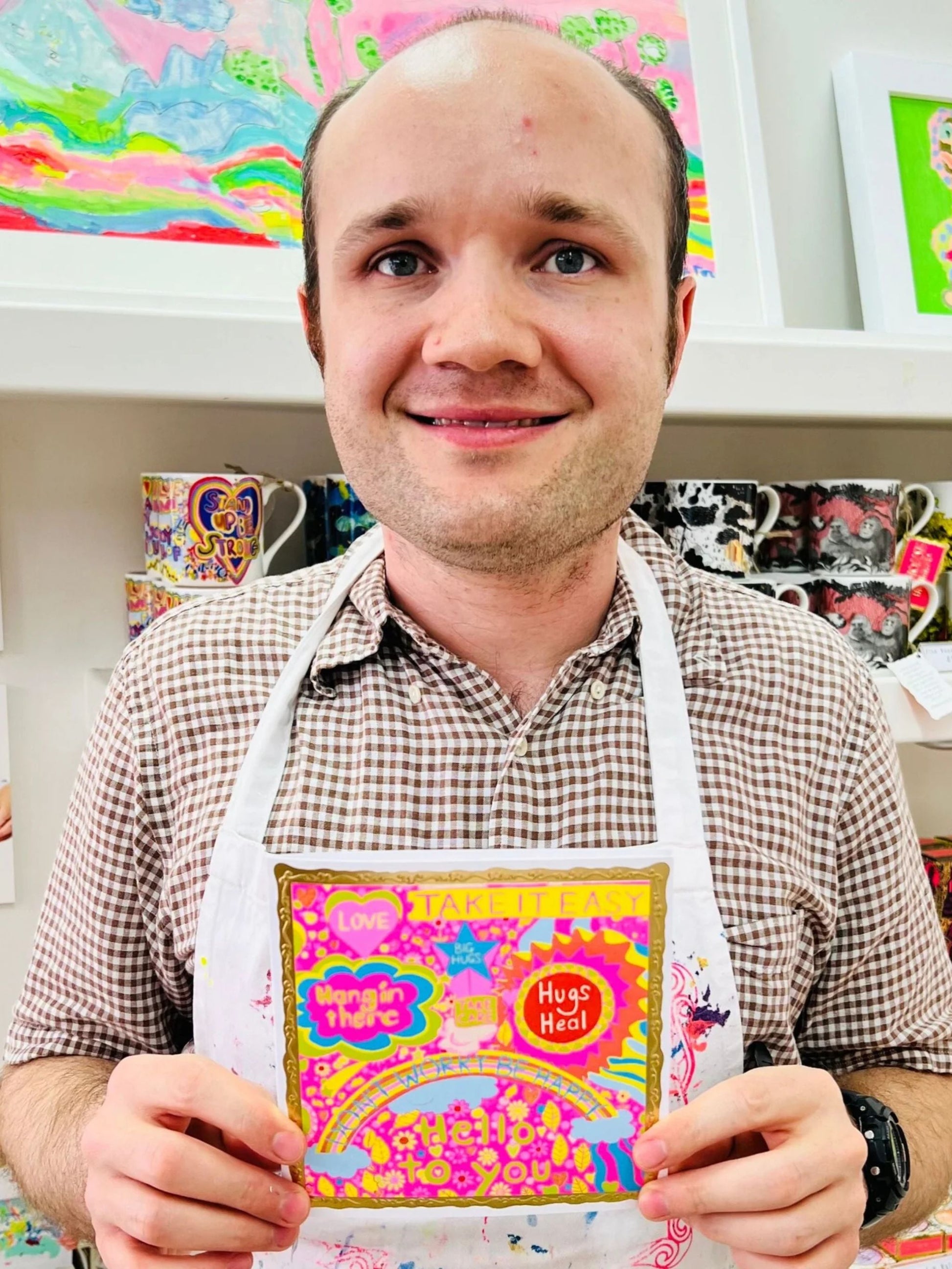 Arthouse Unlimited Take It Easy Greetings Card held by Artist Jack