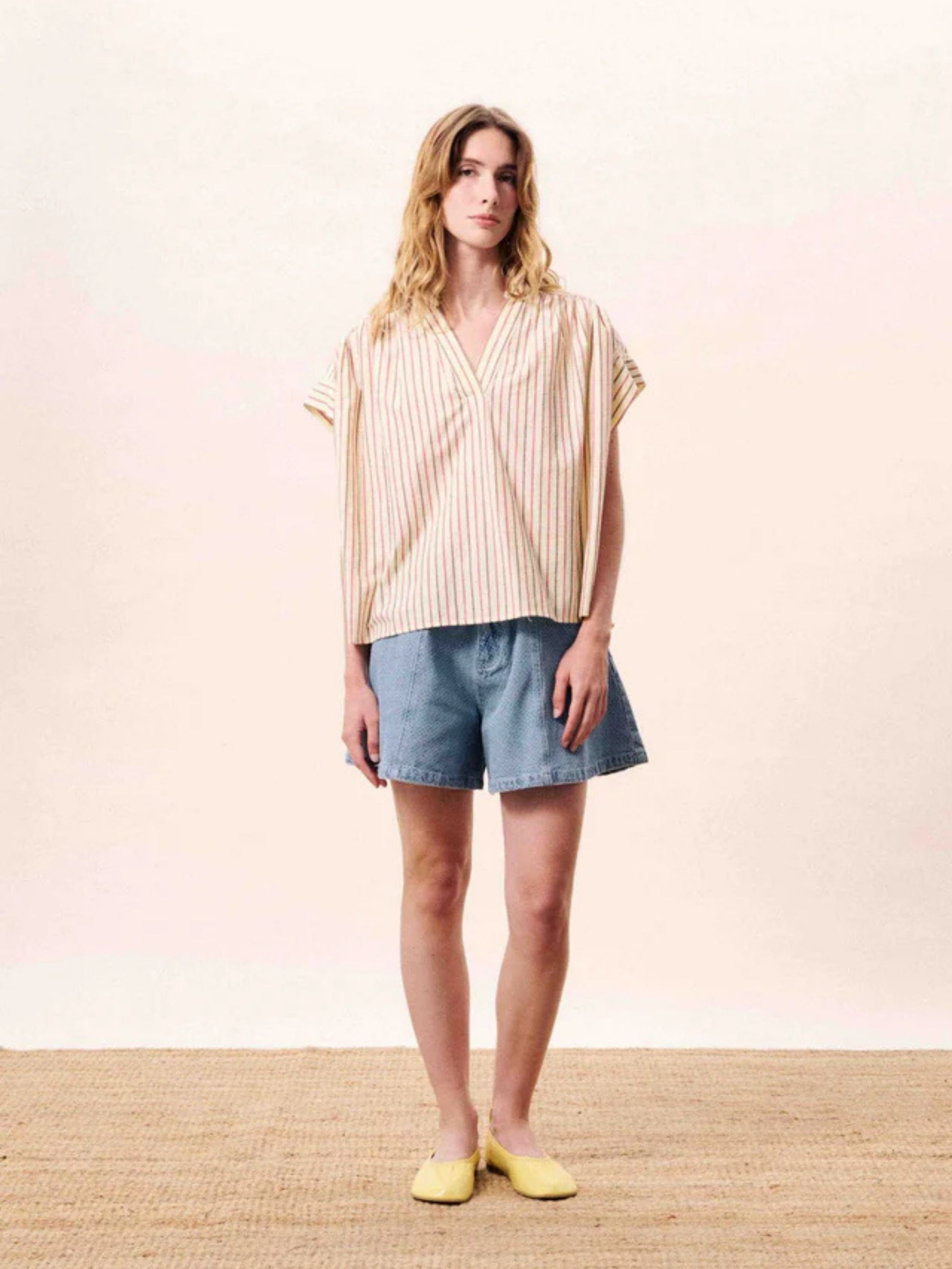 Butter yellow striped cotton blouse with a relaxed fit, button front.