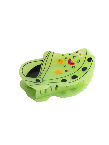 Green Croc inspired shaped hair clip on white background.