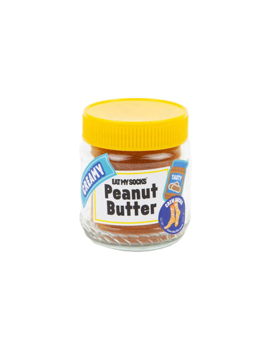 Jar of socks made to look like peanut butter with a yellow lid on a white background