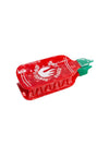 Red hot sauce bottle shaped hair clip on a white background