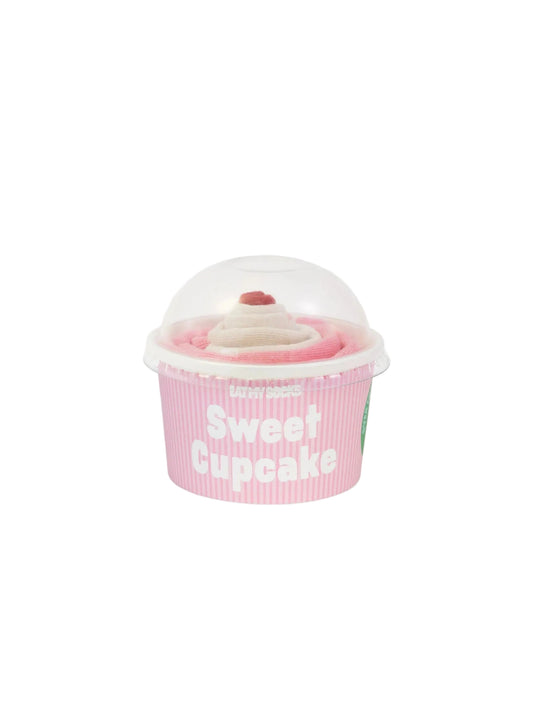 Pink cupcake-shaped container with a pair of pink and white socks inside on a white background