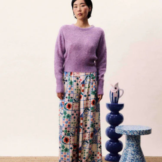Wide-leg patchwork print trousers with high waist and side-tie fastening in a multicoloured bohemian design.