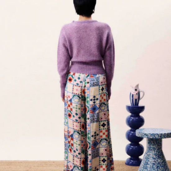 Wide-leg patchwork print trousers with high waist and side-tie fastening in a multicoloured bohemian design.
