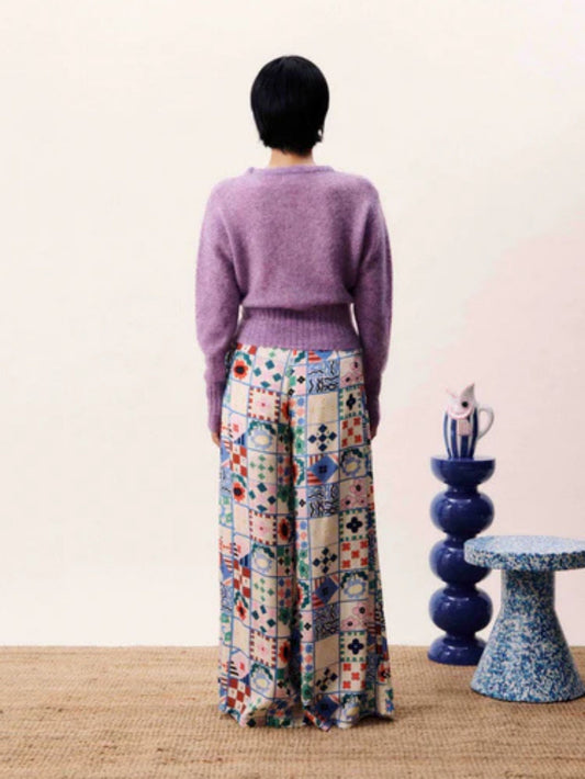 Wide-leg patchwork print trousers with high waist and side-tie fastening in a multicoloured bohemian design.