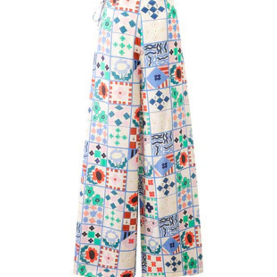 Wide-leg patchwork print trousers with high waist and side-tie fastening in a multicoloured bohemian design.