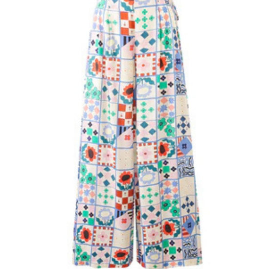 Wide-leg patchwork print trousers with high waist and side-tie fastening in a multicoloured bohemian design.