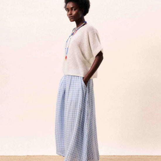 Light blue gingham A line midi skirt with a flowing silhouette.