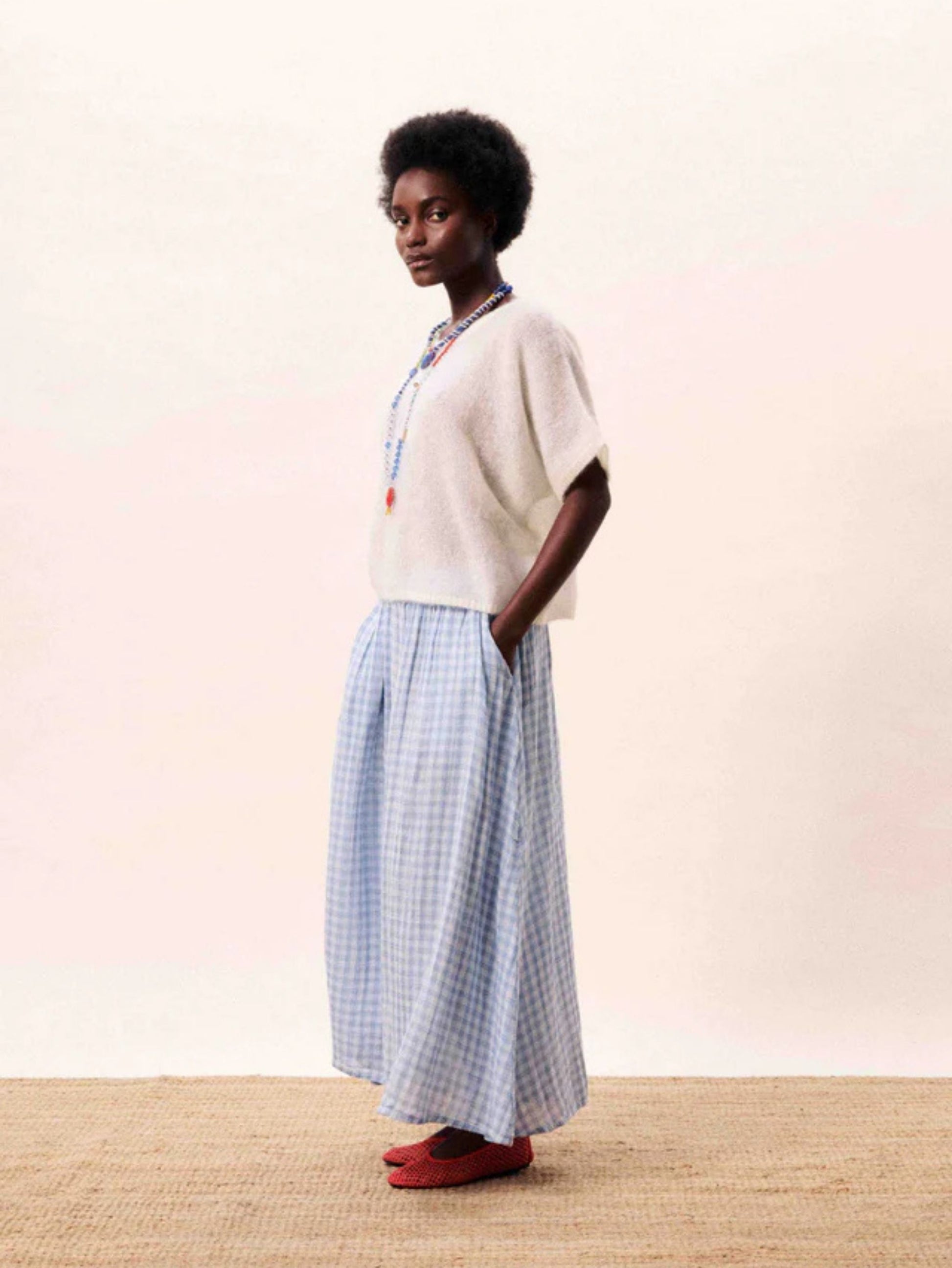 Light blue gingham A line midi skirt with a flowing silhouette.