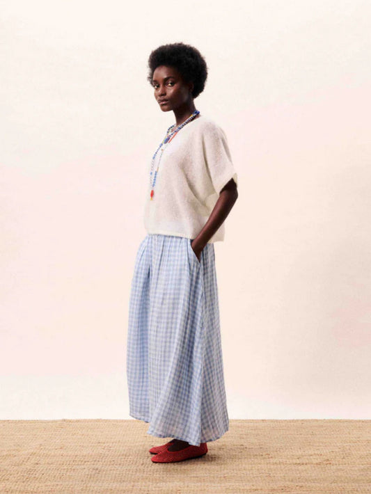 Light blue gingham A line midi skirt with a flowing silhouette.