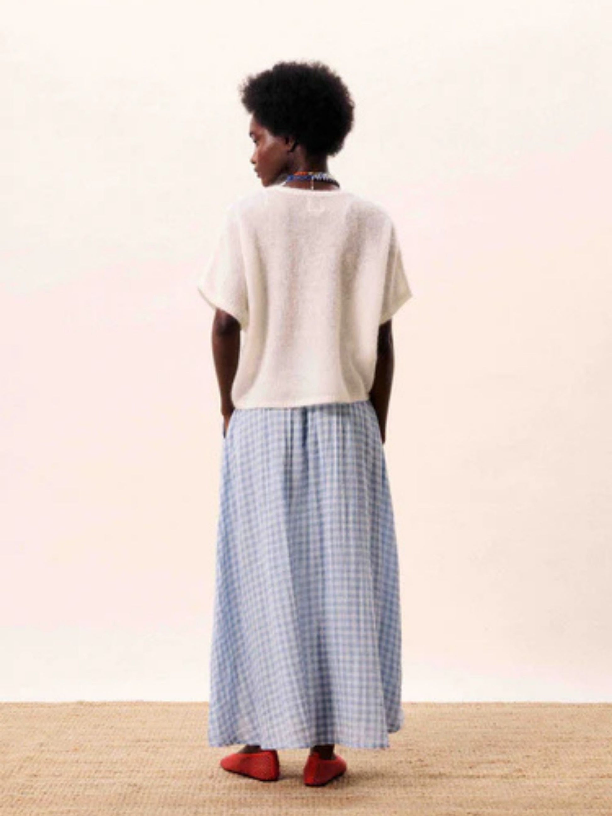 Light blue gingham A line midi skirt with a flowing silhouette.