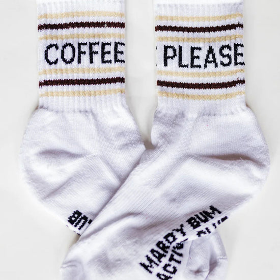 White socks with text 'Coffee Please' and 'Mardy Bum' on a white background