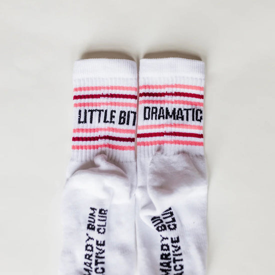 White socks with text on a light gray background