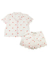 A two-piece women's pyjama set featuring a short-sleeve button-up top and matching shorts in white, both decorated with a small red heart pattern and scalloped edges.