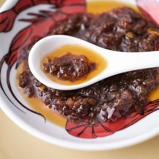 Jar of Poons London WO Sauce  in a bowl