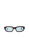 Sunglasses with tortoiseshell frame and blue lenses on a white background