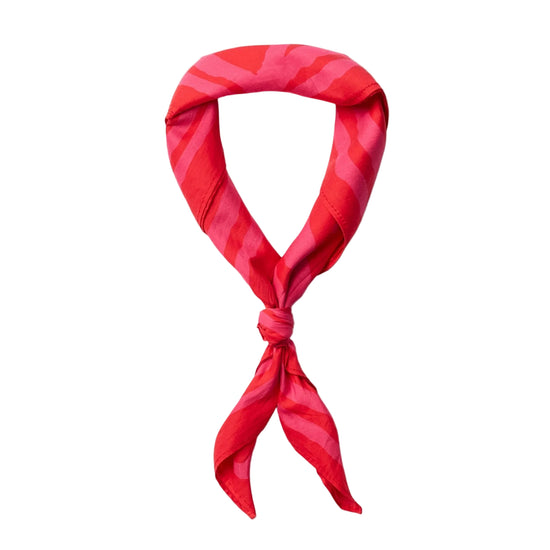Red patterned scarf tied in a knot on a white background
