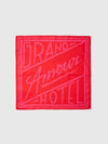 Red bandana with 'Grand Amour Hotel' text on a white background
